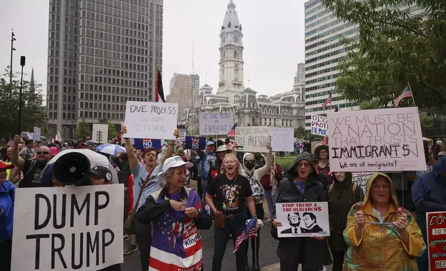 Demonstrators participate in the "No Kings" protest, Saturday, June 14, 2025, in Philadelphia. (AP Photo/Yuki Iwamura)