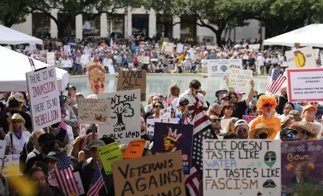 People gather at the "No Kings" nationwide demonstration on Saturday, June 14, 2025 in Houston. (Raquel Natalicchio/Houston Chronicle via AP)