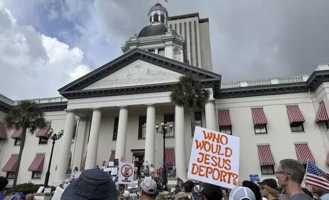 People gather on the grounds of Florida’s old capitol in Tallahassee, Fla., for “No Kings” protest on Saturday, June 14, 2025. (AP Photo/Kate Payne)