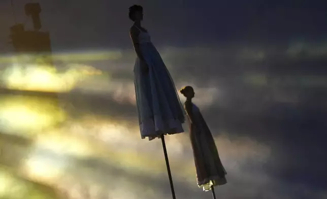 Circus staff performer during the Glastonbury Festival on Worthy Farm, in Somerset, England, Wednesday, June 25, 2025. (Scott A Garfitt/Invision/AP)