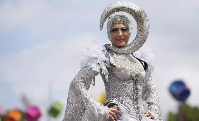 A stilt walker during the Glastonbury Festival in Worthy Farm, Somerset, England, Thursday, June 26, 2025. (Scott A Garfitt/Invision/AP)