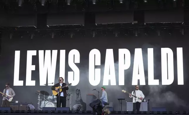 Lewis Capaldi performs during the Glastonbury Festival in Worthy Farm, Somerset, England, Friday, June 27, 2025. (Scott A Garfitt/Invision/AP)