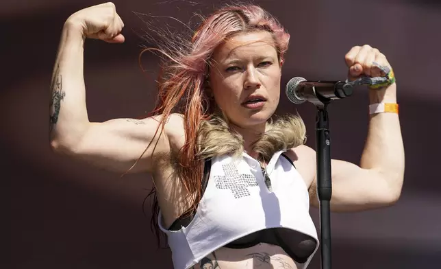 Rhian Teasdale of the rock band Wet Leg performs during the Glastonbury Festival in Worthy Farm, Somerset, England, Friday, June 27, 2025. (Scott A Garfitt/Invision/AP)