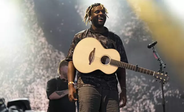 Myles Smith performs during the Glastonbury Festival in Worthy Farm, Somerset, England, Friday, June 27, 2025. (Scott A Garfitt/Invision/AP)