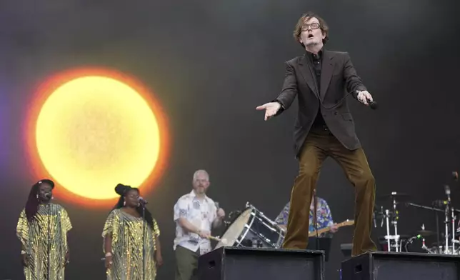 Jarvis Cocker of the rock band Pulp performs during the Glastonbury Festival in Worthy Farm, Somerset, England, Saturday, June 28, 2025. (Scott A Garfitt/Invision/AP)
