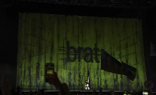 Charli xcx performs during the Glastonbury Festival in Worthy Farm, Somerset, England, Saturday, June 28, 2025. (Scott A Garfitt/Invision/AP)