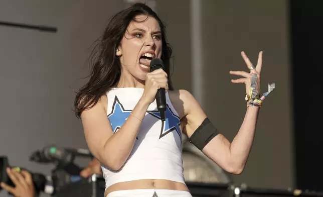 Ellie Rowsell of the rock band Wolf Alice performs during the Glastonbury Festival in Worthy Farm, Somerset, England, Sunday, June 29, 2025. (Scott A Garfitt/Invision/AP)