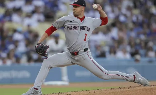 Washington Nationals pitcher MacKenzie Gore delivers to a Los Angeles Dodgers batter during the first inning of a baseball game in Los Angeles, Friday, June 20, 2025. (AP Photo/Jessie Alcheh)