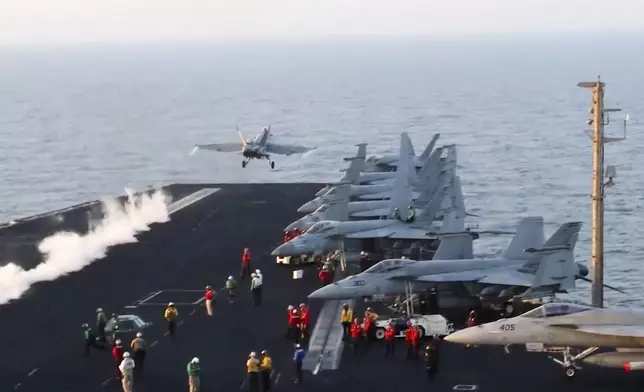 FILE - This image taken from video provided by the U.S. Navy shows an aircraft launching from the USS Harry S. Truman in the Red Sea before airstrikes in Sanaa, Yemen, March 15, 2025. (U.S. Navy via AP, File)