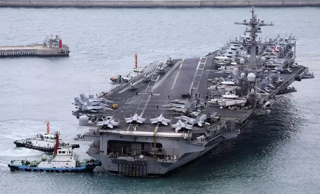 FILE - The USS Carl Vinson aircraft carrier is escorted into a navy port in Busan, South Korea, March 2, 2025. (Son Hyung-ju/Yonhap via AP, File)