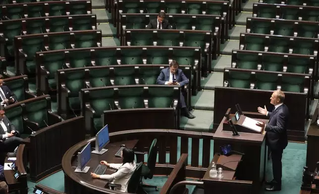 Poland's Prime Minister Donald Tusk addresses the Polish parliament on Wednesday, June 11, 2025, in Warsaw, Poland. (AP Photo/Czarek Sokolowski)