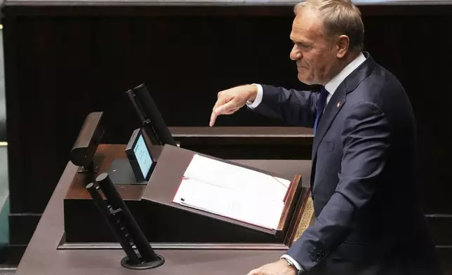 Poland's Prime Minister Donald Tusk addresses the Polish parliament on Wednesday, June 11, 2025, in Warsaw, Poland. (AP Photo/Czarek Sokolowski)