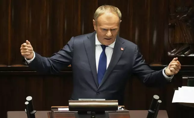 Poland's Prime Minister Donald Tusk addresses the Polish parliament on Wednesday, June 11, 2025, in Warsaw, Poland. (AP Photo/Czarek Sokolowski)