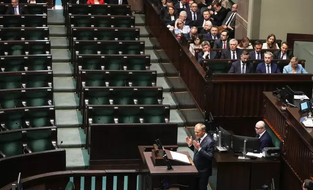 Poland's Prime Minister Donald Tusk addresses the Polish parliament on Wednesday, June 11, 2025, in Warsaw, Poland. (AP Photo/Czarek Sokolowski)