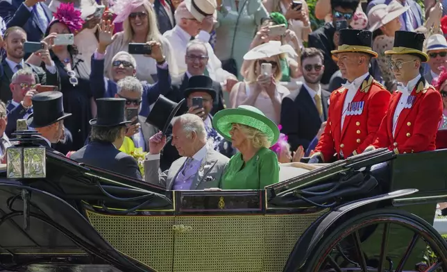 Britain's King Charles and Queen Camilla arrive by carriage into the Parade Ring on the second day of the Royal Ascot horse race meeting at Ascot, England, Wednesday June 18, 2025. (AP Photo/Alberto Pezzali) (AP Photo/Alberto Pezzali)