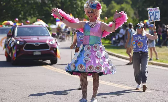 "The Pie Queen" takes part in a parade to celebrate pride month Sunday, June 29, 2025, in Denver. (AP Photo/David Zalubowski)