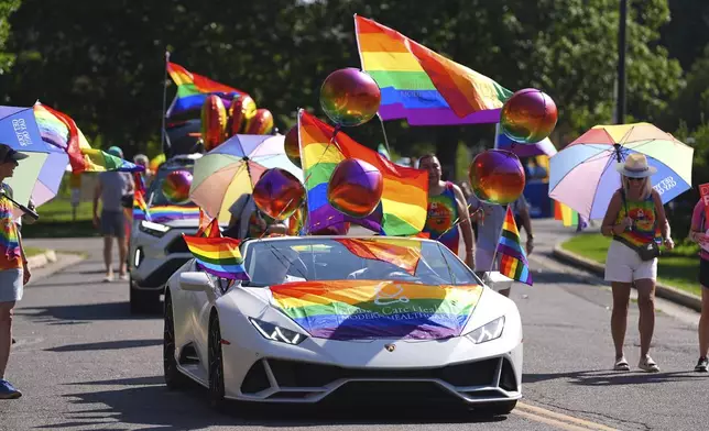 Participants head out of Cheesman Park to take part in a parade to celebrate pride month Sunday, June 29, 2025, in Denver. (AP Photo/David Zalubowski)