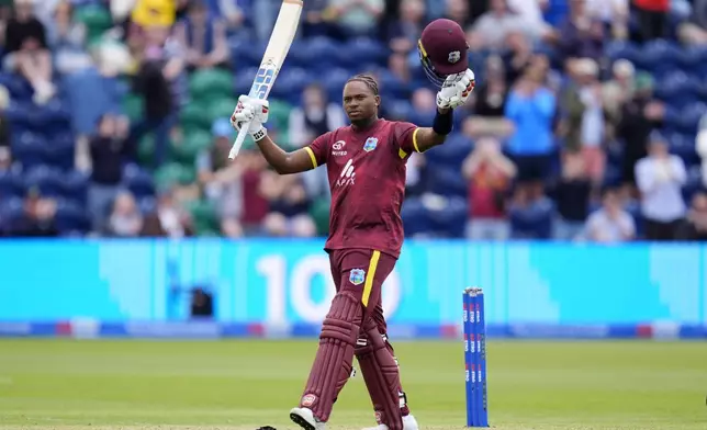 West Indies' Keacy Carty celebrates after scoring his hundred during the Second Men's One Day International cricket match against England at Sophia Gardens, Cardiff, Wales, Sunday, June 1, 2025. (Nick Potts/PA via AP)
