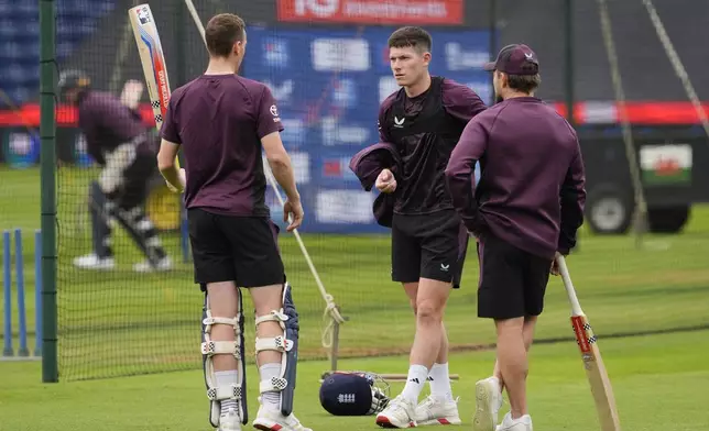 England's Harry Brook, left, Matthew Potts, center, and head coach Brendon McCullum attend a nets session at Sophia Gardens, Cardiff, Wales, Saturday May 31, 2025. (Nick Potts/PA via AP)