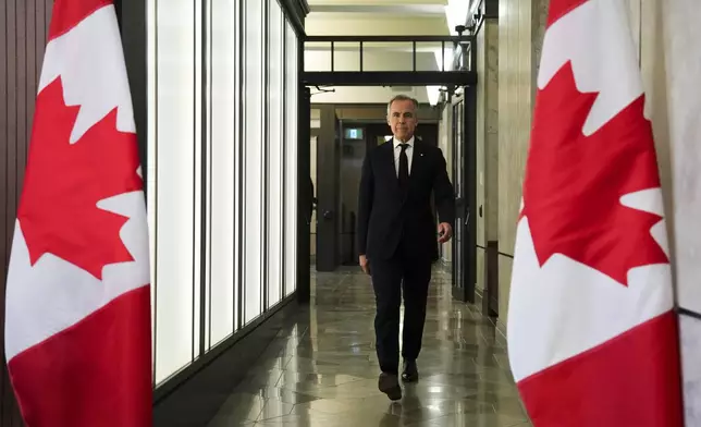 Prime Minister Mark Carney arrives to hold a press conference on Parliament Hill in Ottawa on Friday, June 6, 2025. (Sean Kilpatrick /The Canadian Press via AP)