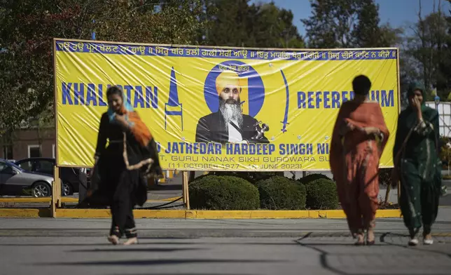 FILE - A photograph of late temple president Hardeep Singh Nijjar is seen on a banner outside the Guru Nanak Sikh Gurdwara Sahib in Surrey, British Columbia, on Sept. 18, 2023. (Darryl Dyck/The Canadian Press via AP, File)