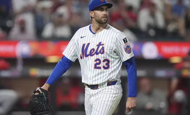 New York Mets pitcher David Peterson looks to the outfield as he walks to the dugout during the eighth inning of a baseball game against the Washington Nationals Wednesday, June 11, 2025, in New York. (AP Photo/Frank Franklin II)