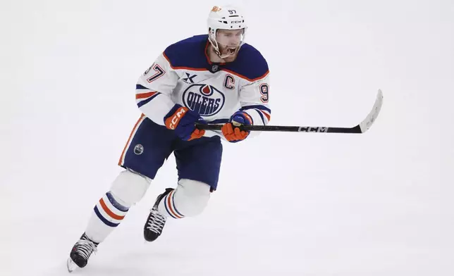 Edmonton Oilers center Connor McDavid celebrates after scoring against the Dallas Stars during the second period of Game 5 of the Western Conference finals in the NHL hockey Stanley Cup playoffs, Thursday, May 29, 2025, in Dallas. (AP Photo/Gareth Patterson)