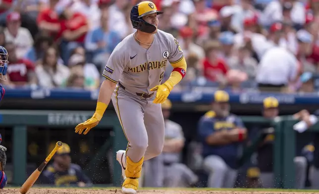 Milwaukee Brewers' Jake Bauers hits a two-run double during the seventh inning of a baseball game against the Philadelphia Phillies, Sunday, June 1, 2025, in Philadelphia. (AP Photo/Chris Szagola)