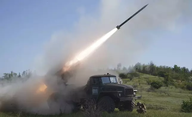 Soldiers of Ukraine's 30th Separate Mechanized Brigade fire a Grad multiple rocket launcher towards Russian positions at the frontline in Donetsk region, Ukraine, Tuesday, June 3, 2025. (AP Photo/Andrii Marienko)