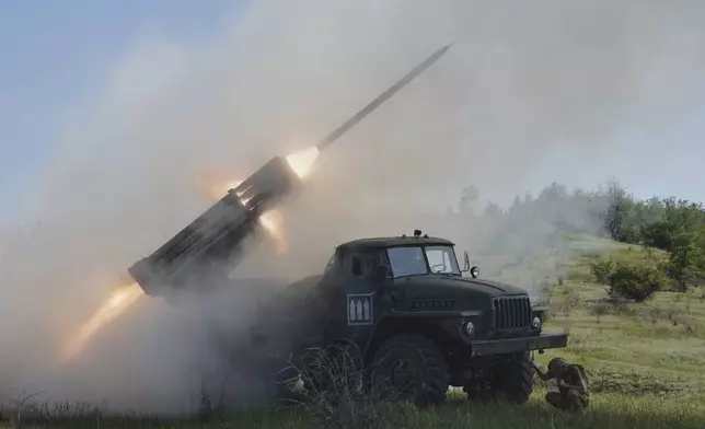 Soldiers of Ukraine's 30th Separate Mechanized Brigade fire a Grad multiple rocket launcher towards Russian positions at the frontline in Donetsk region, Ukraine, Tuesday, June 3, 2025. (AP Photo/Andrii Marienko)