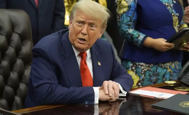 President Donald Trump answers questions from reporters as he meets with Congo's Foreign Minister Therese Kayikwamba Wagner, and Rwanda's Foreign Minister Olivier Nduhungirehe, Friday, June 27, 2025, in the Oval Office at the White House in Washington. (AP Photo/Manuel Balce Ceneta)