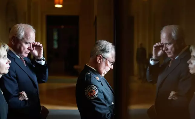 Gwen Walz, left, and Gov. Tim Walz exit the Basilica of St. Mary following funeral services for Mark and Melissa Hortman at the church in Minneapolis, Minn., on Saturday, June 28, 2025. (Alex Kormann/Star Tribune via AP, Pool)