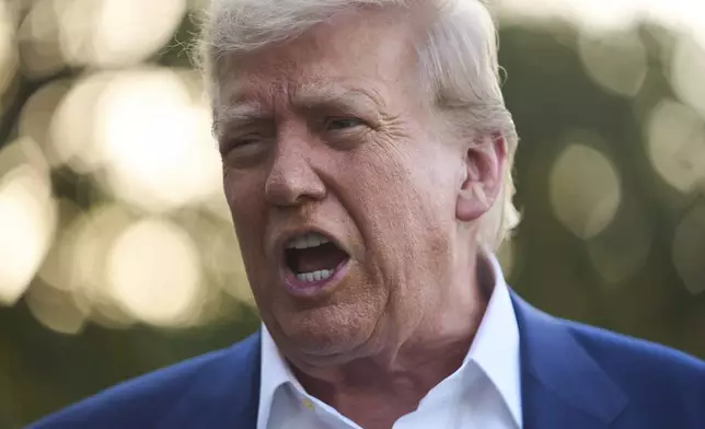 President Donald Trump speaks with reporters before boarding Marine One on the South Lawn of the White House, Tuesday, June 24, 2025, in Washington. (AP Photo/Evan Vucci)