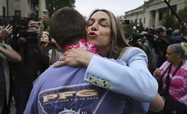 Karen Read embraces a supporter as she leaves the courthouse at the start of the third day of jury deliberations in her trial at Norfolk Superior Court, Wednesday, June 18, 2025, in Dedham, Mass. (AP Photo/Josh Reynolds)