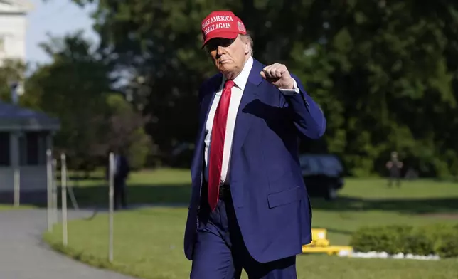 President Donald Trump walks on the South Lawn upon arriving at the White House, Saturday, June 21, 2025, in Washington. (AP Photo/Jose Luis Magana)