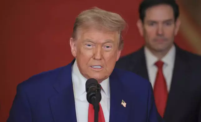 President Donald Trump speaks from the East Room of the White House in Washington, Saturday, June 21, 2025, after the U.S. military struck three Iranian nuclear and military sites, directly joining Israel's effort to decapitate the country's nuclear program, as Secretary of State Marco Rubio listens. (Carlos Barria/Pool via AP)