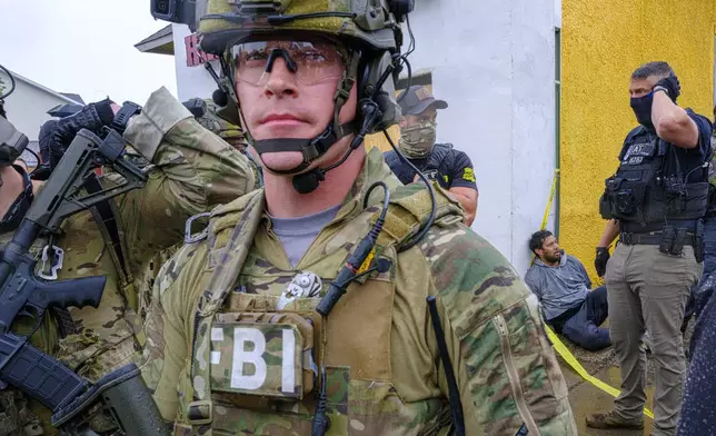 Federal agents detain a man during an operation, Tuesday, June 3, 2025, in Minneapolis, Minn. (Kerem Yücel/Minnesota Public Radio via AP)