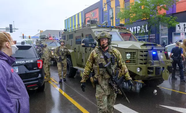 FBI officers secure the area as federal agents conduct an operation in Minneapolis, on Tuesday, June 3, 2025. (Kerem Yücel/Minnesota Public Radio via AP)