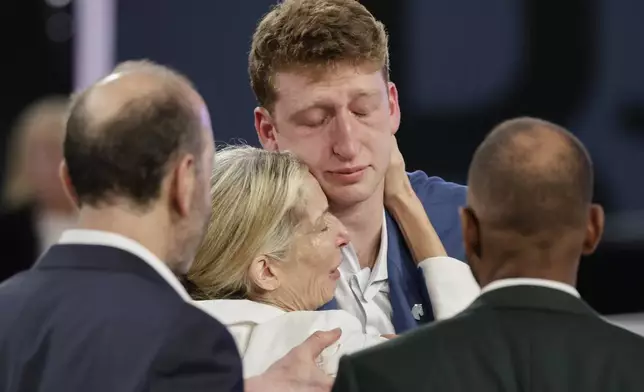 Danny Wolf reacts after being selected 24th by the Brooklyn Nets in the first round of the NBA basketball draft, Wednesday, June 25, 2025, in New York. (AP Photo/Adam Hunger)