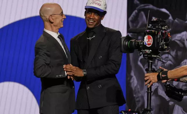 VJ Edgecombe greets NBA commissioner Adam Silver after being selected third by the Philadelphia 76ers In the first round of the NBA basketball draft, Wednesday, June 25, 2025, in New York. (AP Photo/Adam Hunger)