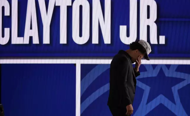 Walter Clayton Jr. reacts after being selected 18th by the Washington Wizards in the first round of the NBA basketball draft, Wednesday, June 25, 2025, in New York. (AP Photo/Adam Hunger)