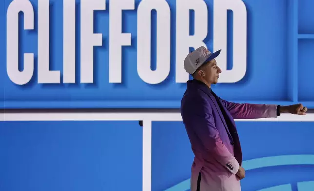 Nique Clifford poses for a camera after being selected 24th by the Oklahoma City Thunder in the first round of the NBA basketball draft, Wednesday, June 25, 2025, in New York. (AP Photo/Adam Hunger)
