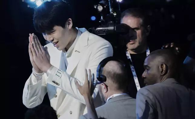 Yang Hansen reacts after being selected 16th by the Memphis Grizzlies in the first round of the NBA basketball draft, Wednesday, June 25, 2025, in New York. (AP Photo/Adam Hunger)