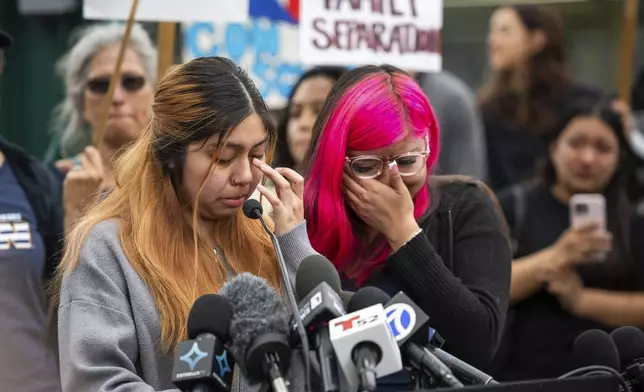 Kimberly Hernandez and her sister Jaslyn Hernandez, daughters of a car wash worker, speak during a press conference with families of detained car wash workers, Wednesday, June 11, 2025, in Culver City, Calif. (AP Photo/Ethan Swope)