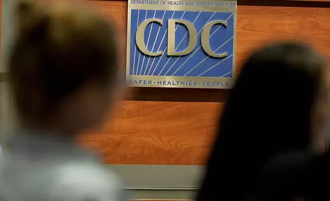 Participants listen during a meeting of the Advisory Committee in Immunization Practices at the CDC, Wednesday, June 25, 2025, in Atlanta. (AP Photo/Mike Stewart)