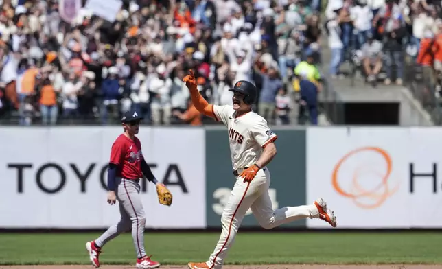 San Francisco Giants' Matt Chapman, right, celebrates as he runs the bases following his game-winning, two-run home run against the Atlanta Braves in the ninth inning of a baseball game Saturday, June 7, 2025, in San Francisco. (AP Photo/Godofredo A. Vásquez)