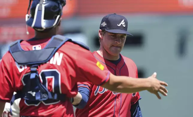 Atlanta Braves pitcher Bryce Elder, right, and catcher Drake Baldwin walk to the dugout after the seventh inning of a baseball game against the San Francisco Giants, Saturday, June 7, 2025, in San Francisco. (AP Photo/Godofredo A. Vásquez)