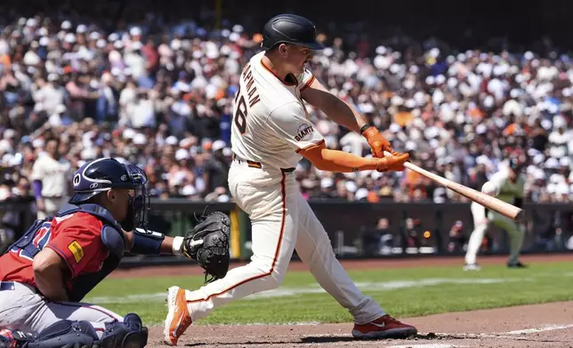 San Francisco Giants' Matt Chapman hits a game-winning two-run home run during the ninth inning of a baseball game against the Atlanta Braves, Saturday, June 7, 2025, in San Francisco. (AP Photo/Godofredo A. Vásquez)
