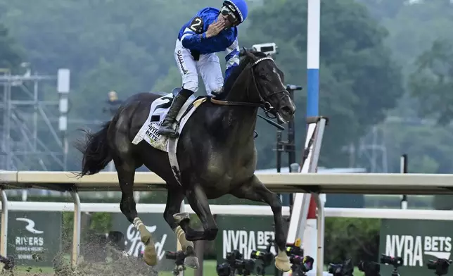 Jockey Junior Alvarado reacts aboard Sovereignty (2), as he crosses the finish line to win the 157th running of the Belmont Stakes horse race, Saturday, June 7, 2025, in Saratoga Springs, N.Y. (AP Photo/Jessica Hill)