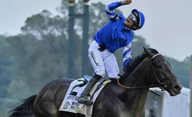 Jockey Junior Alvarado reacts aboard Sovereignty (2), after crossing the finish line to win the 157th running of the Belmont Stakes horse race, Saturday, June 7, 2025, in Saratoga Springs, N.Y. (AP Photo/Jessica Hill)